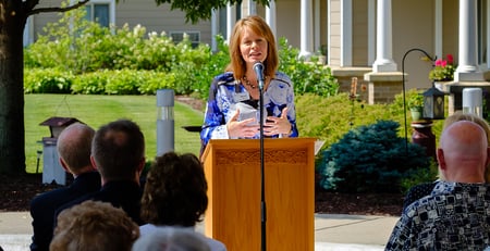 woman speaking to crowd